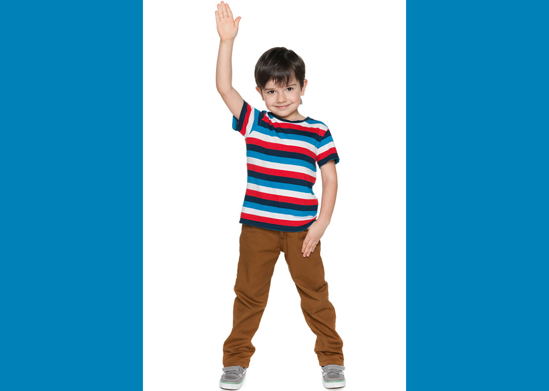 boy in striped shirt raising hand - SergiyN/iStock/Getty Images