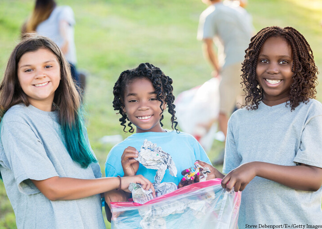 three girls picking up trash on park cleanup day - Steve Debenport/E+/Getty Images