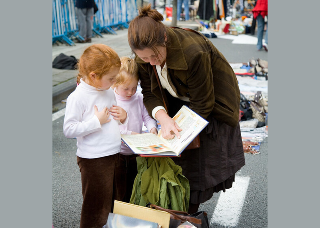 woman reading to children - 	FrankyDeMeyer/iStock/Getty Images