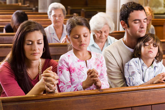 people praying in church