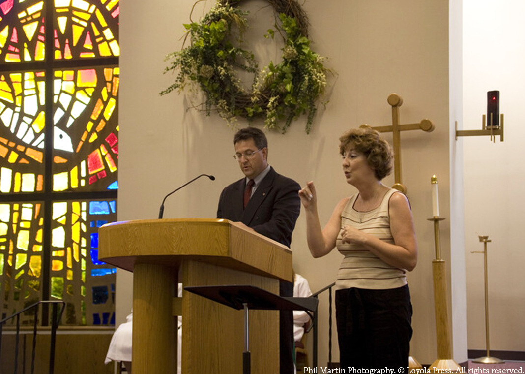 prayer leaders - lector and sign language interpreter - Phil Martin Photography. © Loyola Press. All rights reserved.