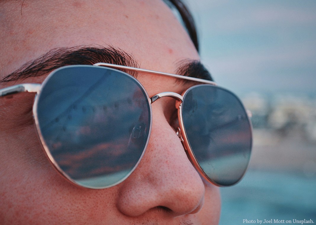 reflective sunglasses - photo by Joel Mott on Unsplash