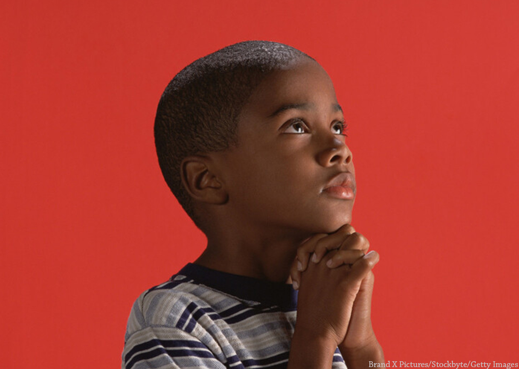 young boy praying with hands folded - Brand X Pictures/Stockbyte/Getty Images