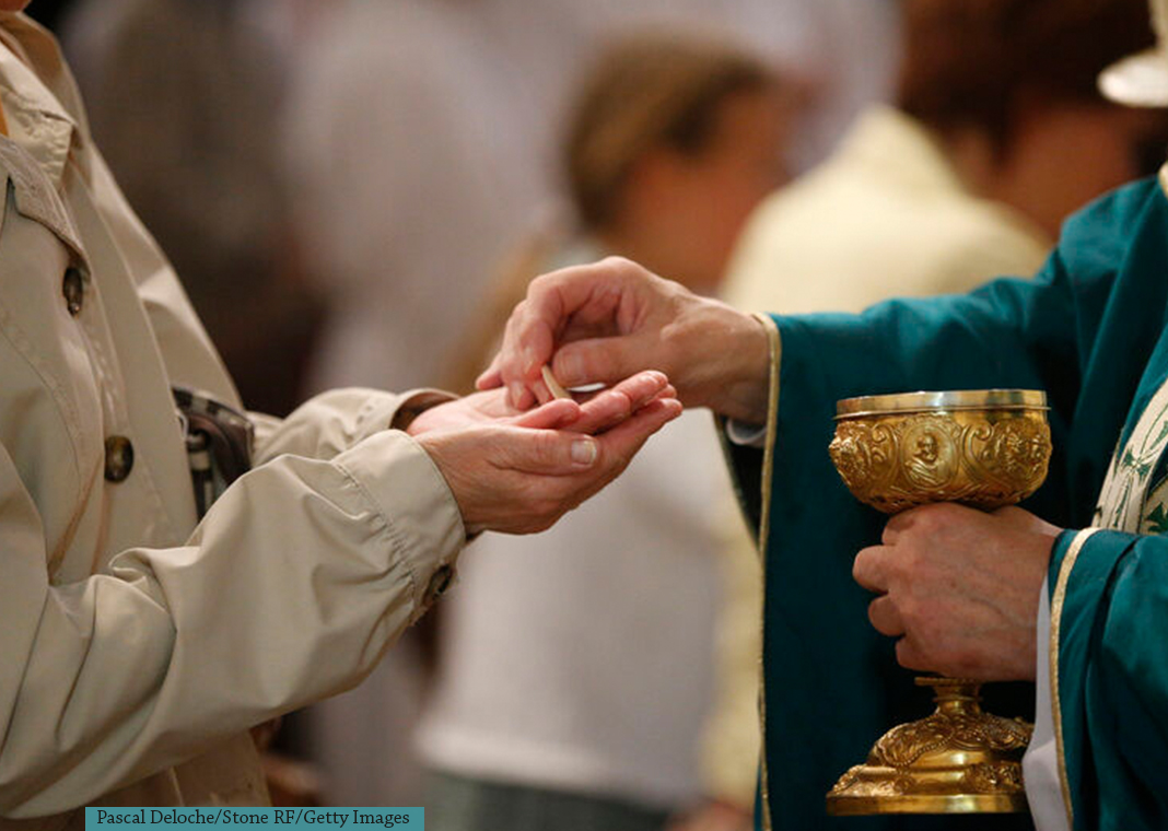 receiving Eucharist - Pascal Deloche/Stone RF/Getty Images