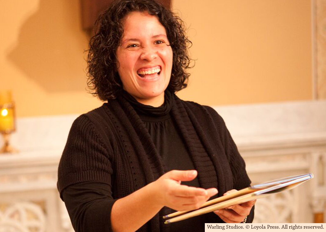 happy catechist holding book - Warling Studios. © Loyola Press. All rights reserved.