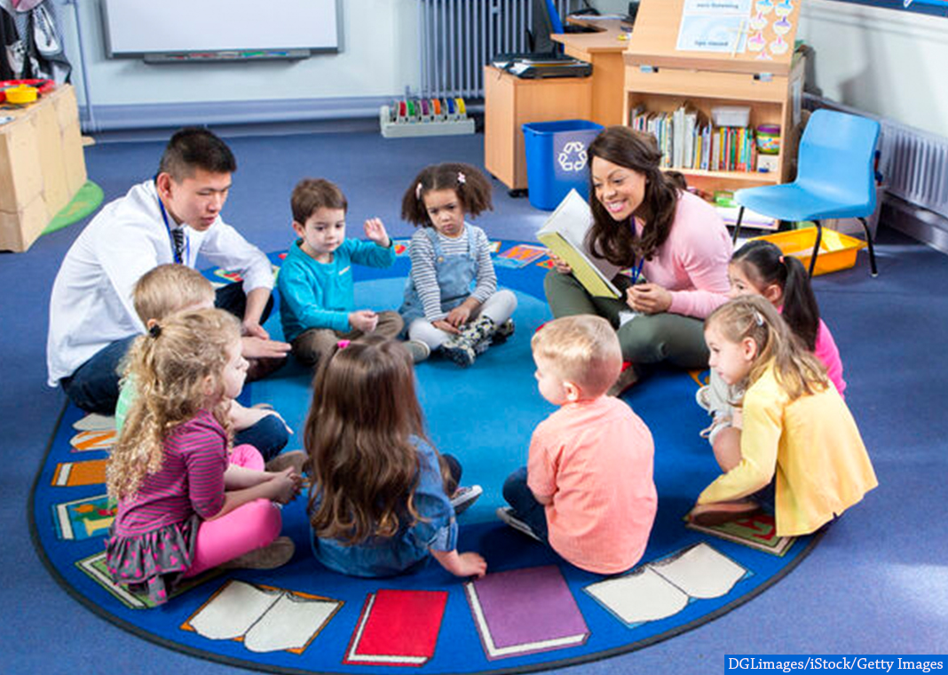teacher reading with young children - DGLimages/iStock/Getty Images
