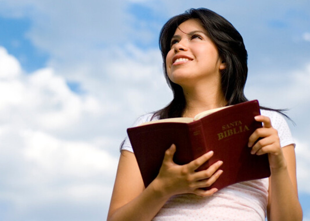 young woman reading the Bible - aldomurillo/E+/Getty Images