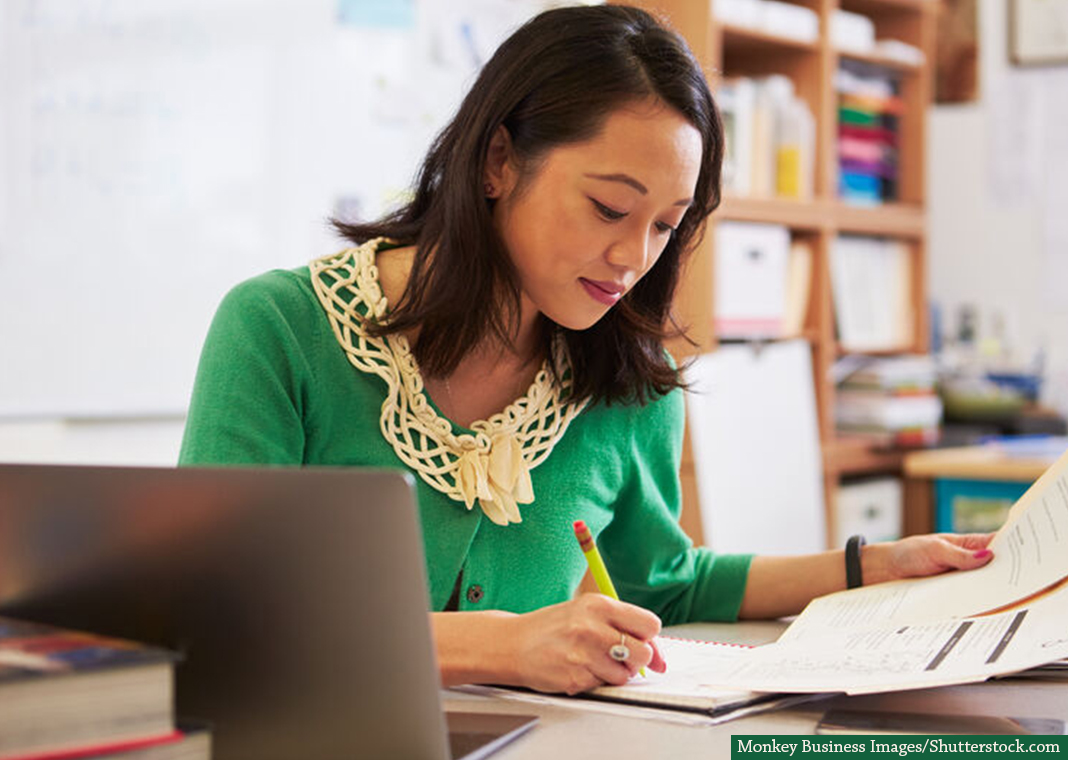 catechist reviewing notes   - Monkey Business Images/Shutterstock.com