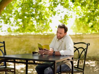 man reading outdoors