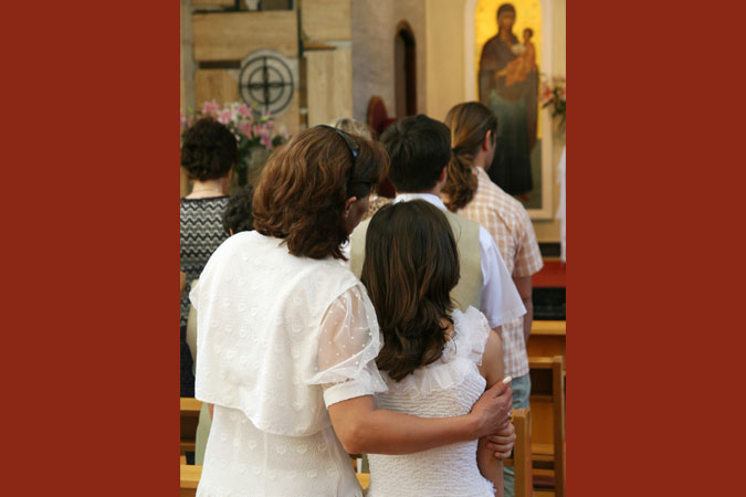 mother and daughter at Mass - in church