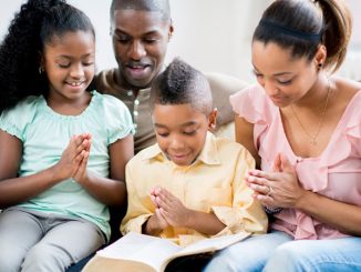 family with Bible at home