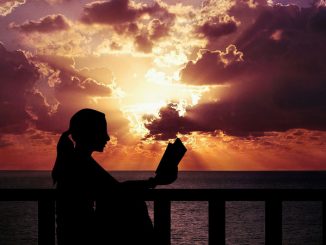 woman reading at dusk