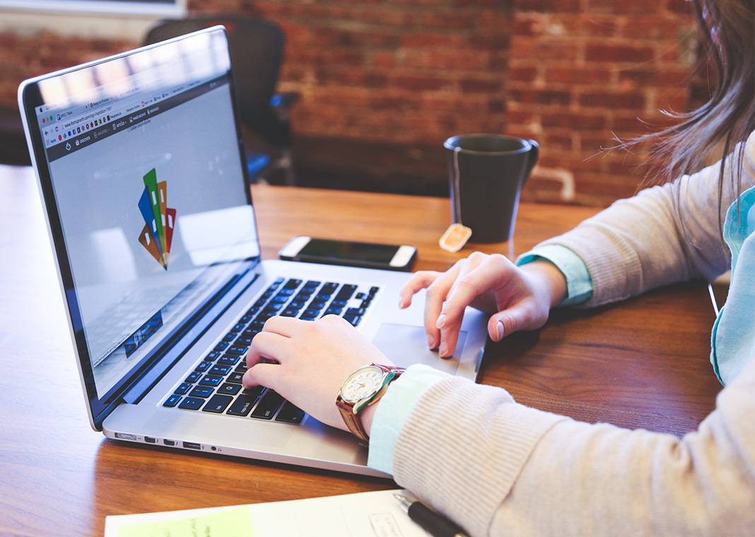 student working on a laptop computer - image by StartupStockPhotos from Pixabay