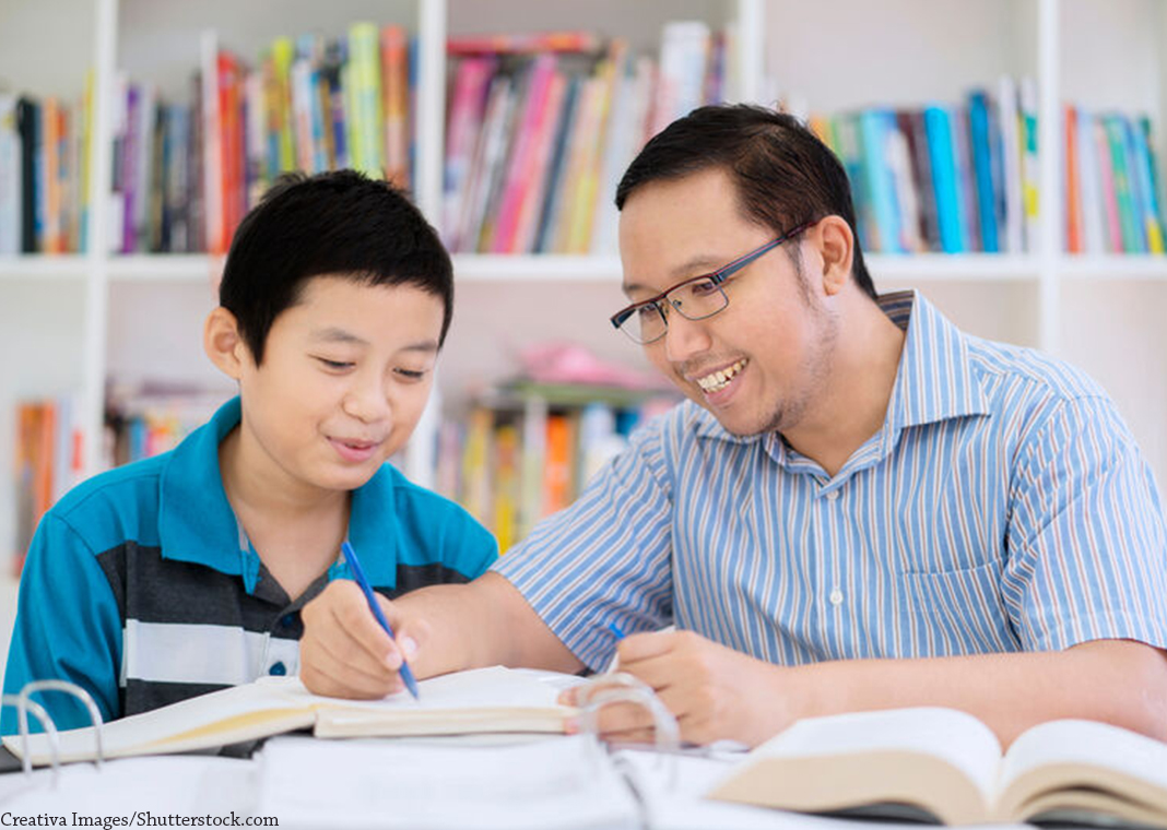 teacher helping student - Creativa Images/Shutterstock.com