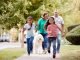 family walking dog - Monkey Business Images/Shutterstock.com