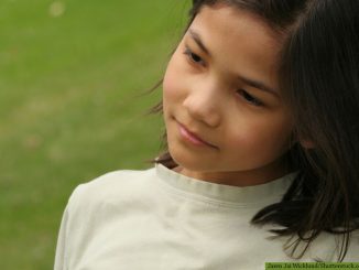girl standing in stillness - Jaren Jai Wicklund/Shutterstock.com