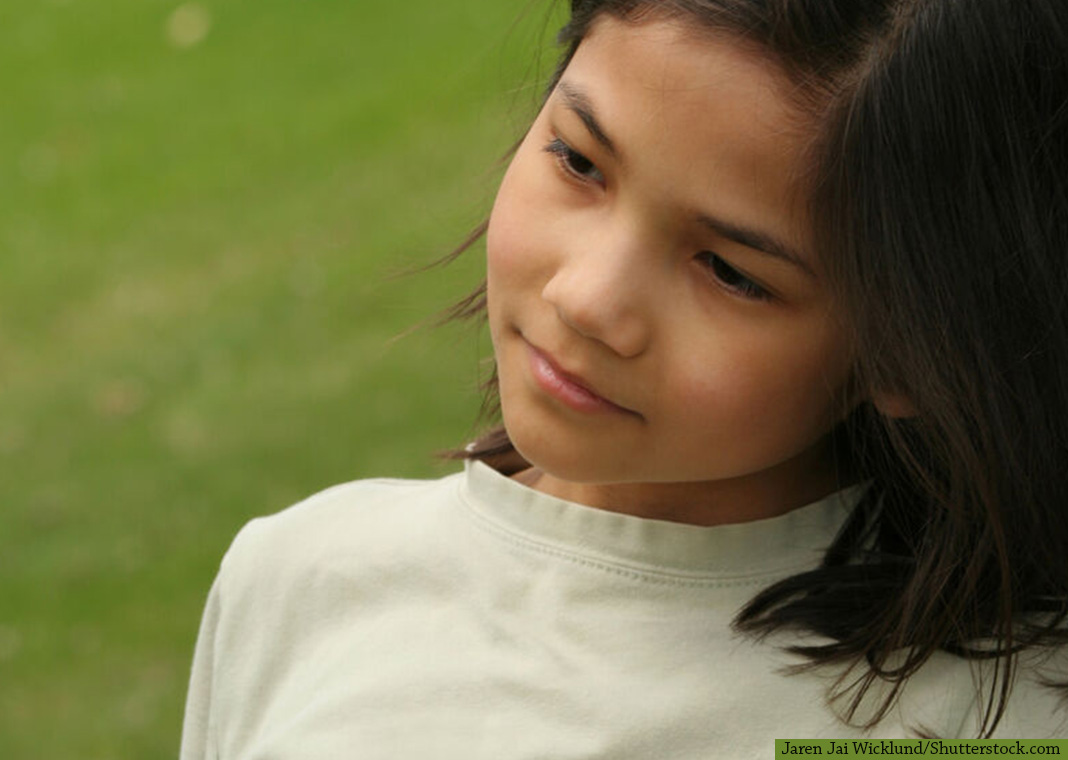girl standing in stillness - Jaren Jai Wicklund/Shutterstock.com