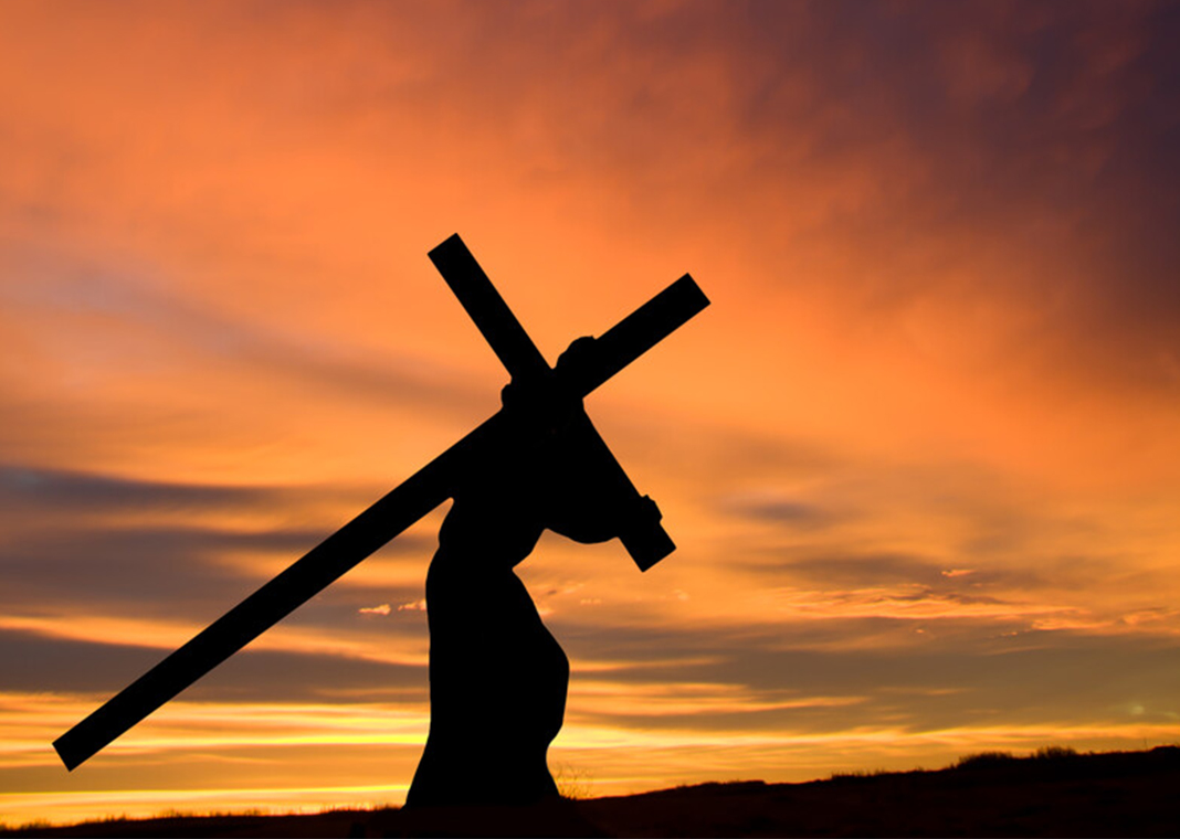 Jesus carrying the cross - silhouette - wwing/E+/Getty Images