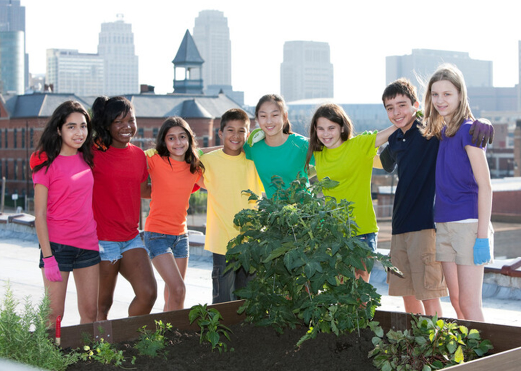 community of children in garden - JBryson/iStock/Getty Images